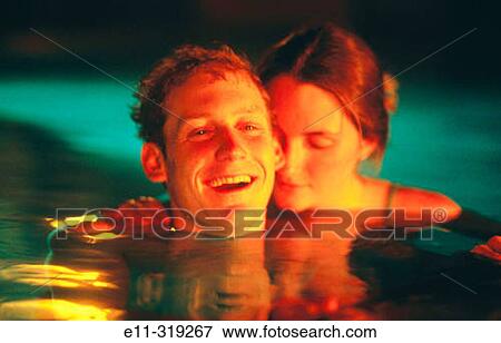 21 year old couple in swimming pool View Large Photo Image Stock Photo - 21 year old couple in swimming pool. Fotosearch