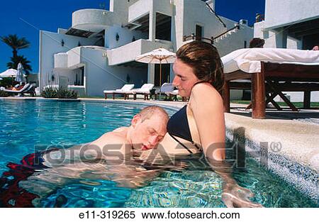 21 year old couple in swimming pool View Large Photo Image Stock Photography - 21 year old couple in swimming pool. Fotosearch