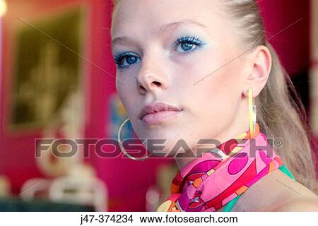 21 year old girl, bright scarf and big hoop earings View Large Photo Image Picture - 21 year old girl, bright scarf and big hoop earings. Fotosearch