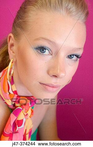 21 year old girl, bright scarf and big hoop earings View Large Photo Image Picture - 21 year old girl, bright scarf and big hoop earings. Fotosearch