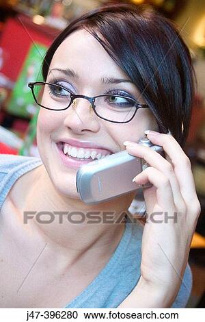 21 year old girl, close-up head shot, smiling off camera, talking on a mobile phone View Large Photo Image Stock Image - 21 year old girl, close-up head shot, smiling off camera, talking on a mobile phone. Fotosearch