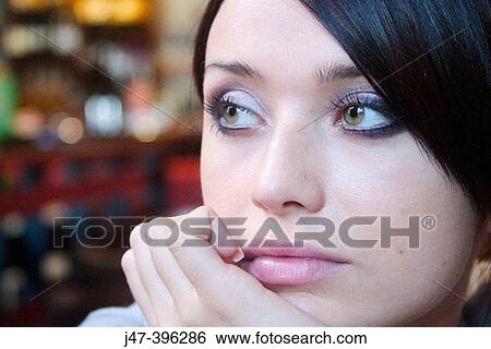 Stock Photograph - 21 year old girl, close-up head shot, smiling off camera. Fotosearch