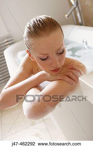 21 year old girl in the bath, leaning on the side, looking down View Large Photo Image Stock Image - 21 year old girl in the bath, leaning on the side, looking down. Fotosearch