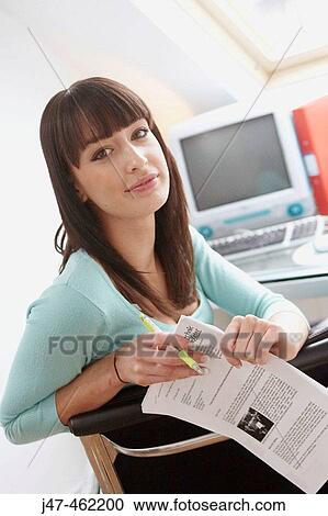 21 year old girl leaning over the back of her chair, smiling View Large Photo Image Stock Image - 21 year old girl leaning over the back of her chair, smiling. Fotosearch
