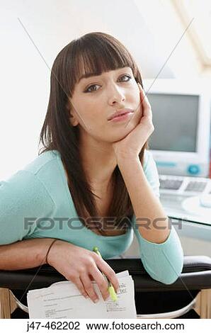 21 year old girl leaning over the back of her chair, looking seriously into camera View Large Photo Image Stock Image - 21 year old girl leaning over the back of her chair, looking seriously into camera. Fotosearch