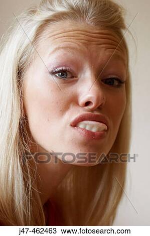 21 year old girl pulling a face with false sweet teeth in View Large Photo Image Stock Image - 21 year old girl pulling a face with false sweet teeth in. Fotosearch