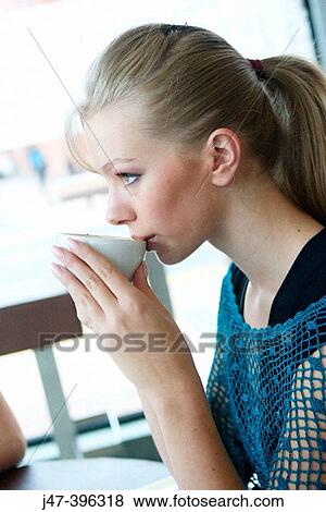 21 year old girl, sitting drinking coffee, profile View Large Photo Image Stock Photo - 21 year old girl, sitting drinking coffee, profile. Fotosearch
