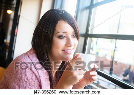 21 year old girl, sitting in bar drinking coffee smiling View Large Photo Image Stock Image - 21 year old girl, sitting in bar drinking coffee smiling. Fotosearch
