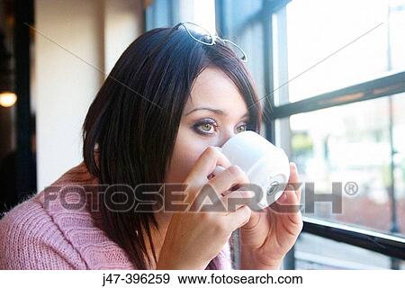 21 year old girl, sitting in bar drinking coffee View Large Photo Image Stock Photo - 21 year old girl, sitting in bar drinking coffee. Fotosearch
