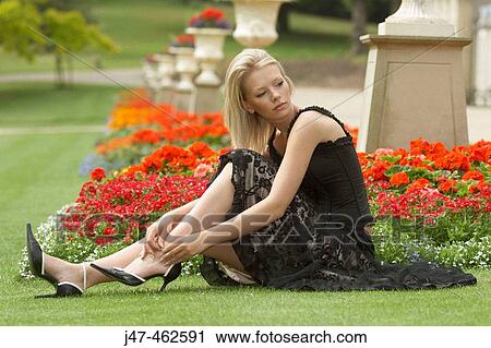 21 year old girl sitting on the grass, looking off camera View Large Photo Image Stock Image - 21 year old girl sitting on the grass, looking off camera. Fotosearch