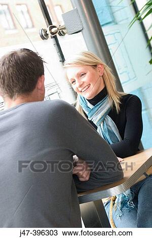 21 year old girl, smiling at man sitting across the table View Large Photo Image Stock Image - 21 year old girl, smiling at man sitting across the table. Fotosearch