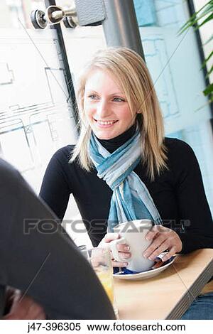 21 year old girl, smiling at man sitting across the table View Large Photo Image Stock Photography - 21 year old girl, smiling at man sitting across the table. Fotosearch