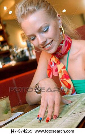 21 year old, looking at the menu View Large Photo Image Stock Photography - 21 year old, looking at the menu. Fotosearch