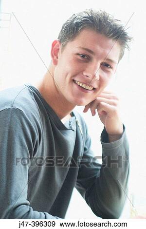 21 year old man, head and shoulders, smiling into camera View Large Photo Image Stock Photo - 21 year old man, head and shoulders, smiling into camera. Fotosearch