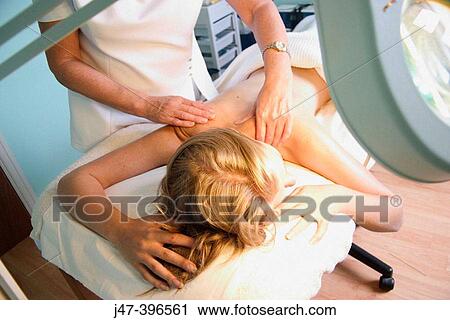 21 year old woman having a back massage at the beauty therapy salon View Large Photo Image Stock Image - 21 year old woman having a back massage at the beauty therapy salon. Fotosearch