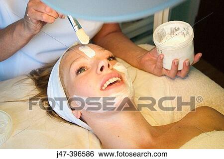 21 year old woman having a face mask applyed at the beauty therapy salon View Large Photo Image Stock Photograph - 21 year old woman having a face mask applyed at the beauty therapy salon. Fotosearch