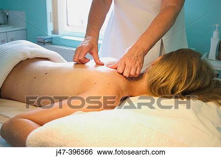 21 year old woman having a massage at the beauty therapy salon View Large Photo Image Stock Photograph - 21 year old woman having a massage at the beauty therapy salon. Fotosearch
