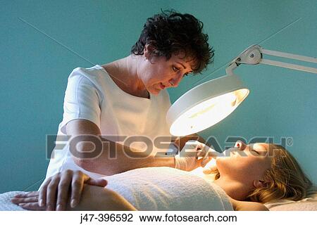 21 year old woman having electrolysis by a beauty therapist View Large Photo Image Stock Image - 21 year old woman having electrolysis by a beauty therapist. Fotosearch
