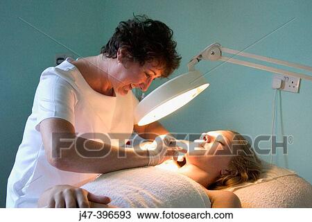 21 year old woman having electrolysis by a beauty therapist View Large Photo Image Stock Image - 21 year old woman having electrolysis by a beauty therapist. Fotosearch