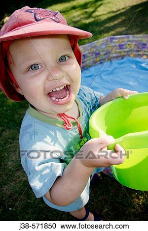 22 month old boy playing with water in the garden, UK View Large Photo Image Stock Image - 22 month old boy playing with water in the garden, UK. Fotosearch