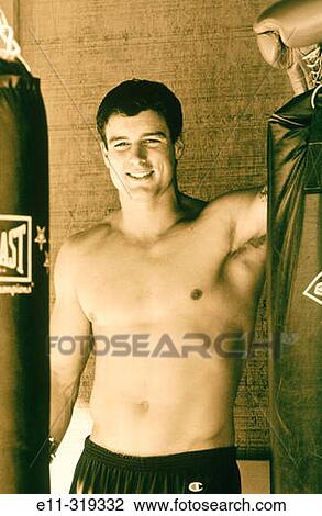 23 year old man with boxing equipment View Large Photo Image Stock Image - 23 year old man with boxing equipment. Fotosearch