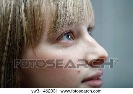 Stock Image - 24 year old blonde Caucasian woman indoors. Fotosearch