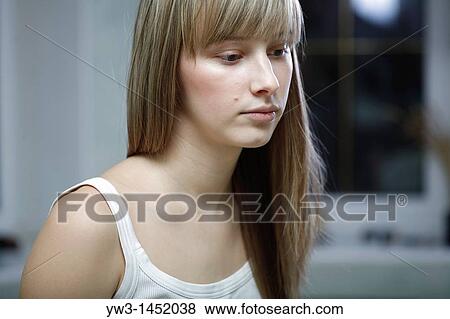 24 year old blonde Caucasian woman wearing a tank top indoors, deep thoughts View Large Photo Image Stock Photo - 24 year old blonde Caucasian woman wearing a tank top indoors, deep thoughts. Fotosearch