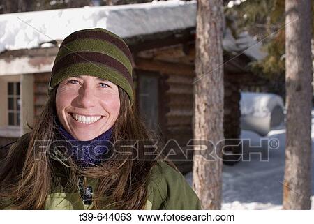 25-35 year old woman portrait in snow with log cabin in background. Teslin River Yukon Territory Canada View Large Photo Image Stock Image - 25-35 year old woman portrait in snow with log cabin in background. Teslin River Yukon Territory Canada. Fotosearch