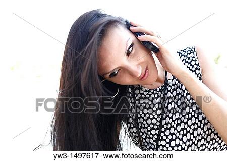 25 year old pretty woman outdoors talking by cell phone View Large Photo Image Stock Photo - 25 year old pretty woman outdoors talking by cell phone. Fotosearch