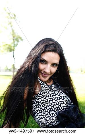 25 year old woman outdoors on the grass View Large Photo Image Stock Photo - 25 year old woman outdoors on the grass. Fotosearch