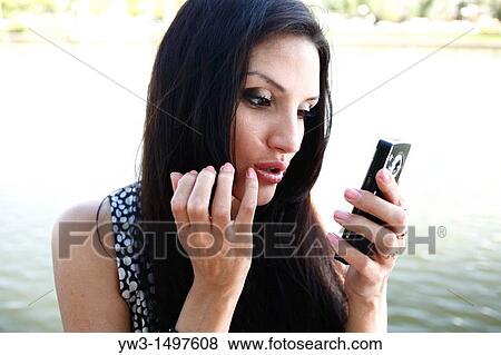 25 year old woman outdoors taking photo of herself View Large Photo Image Stock Photo - 25 year old woman outdoors taking photo of herself. Fotosearch