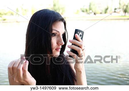 25 year old woman outdoors taking photo of herself View Large Photo Image Stock Photo - 25 year old woman outdoors taking photo of herself. Fotosearch