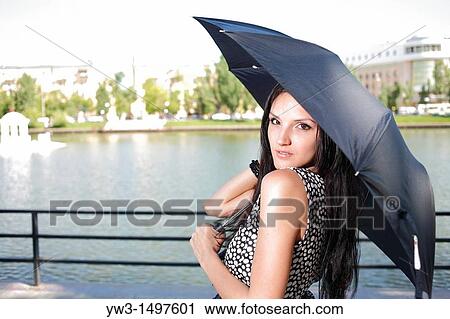25 year old woman outdoors with umbrella View Large Photo Image Stock Image - 25 year old woman outdoors with umbrella. Fotosearch