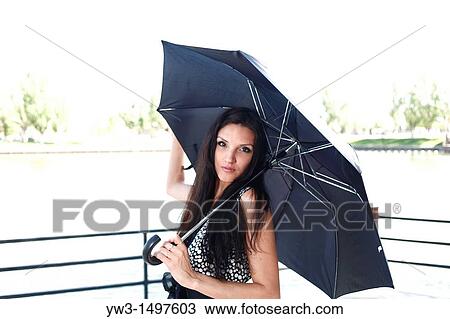 25 year old woman outdoors with umbrella View Large Photo Image Stock Image - 25 year old woman outdoors with umbrella. Fotosearch