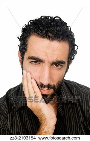 25 years old Middle Eastern man hand on mouth with a toothache. View Large Photo Image Picture - 25 years old Middle Eastern man hand on mouth with a toothache.. Fotosearch