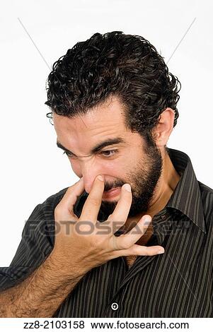 25 years old Middle Eastern man hand over nose from bad smell. View Large Photo Image Stock Photo - 25 years old Middle Eastern man hand over nose from bad smell.. Fotosearch