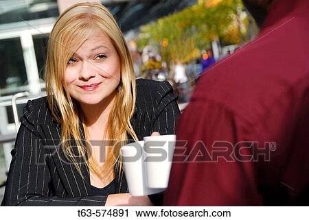 25 yr old caucasian business woman having coffee with ethnic 35 yr old business man View Large Photo Image Stock Image - 25 yr old caucasian business woman having coffee with ethnic 35 yr old business man. Fotosearch