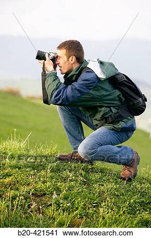 25_30 year old mountain climber taking pictures with digital SLR camera. Guipzcoa, Euskadi, Spain View Large Photo Image Stock Image - 25_30 year old mountain climber taking pictures with digital SLR camera. Guipzcoa, Euskadi, Spain. Fotosearch