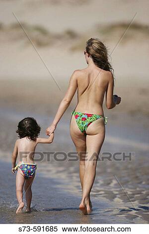 27 year old woman and 3 year old girl on the beach View Large Photo Image Stock Photography - 27 year old woman and 3 year old girl on the beach. Fotosearch