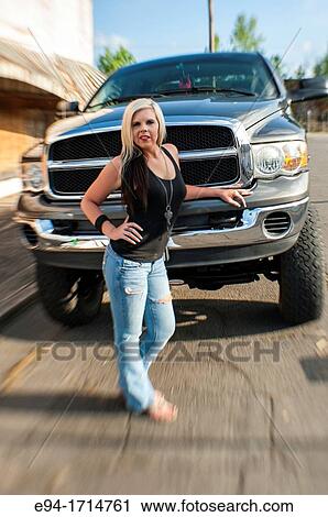 29 year old blond woman standing in front of a big pick up truck smiling at camera View Large Photo Image Stock Image - 29 year old blond woman standing in front of a big pick up truck smiling at camera. Fotosearch