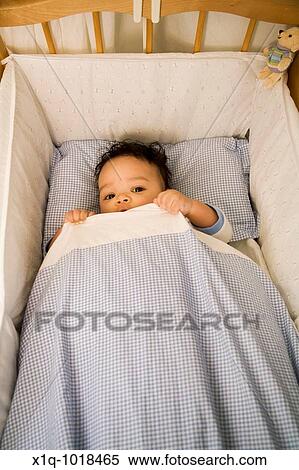 3 1/2 months old boy lying in his bed and hiding under his duvet View Large Photo Image Stock Photography - 3 1/2 months old boy lying in his bed and hiding under his duvet. Fotosearch