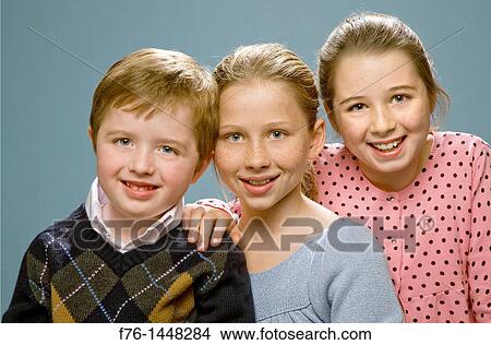 3 children pose for family portrait View Large Photo Image Picture - 3 children pose for family portrait. Fotosearch