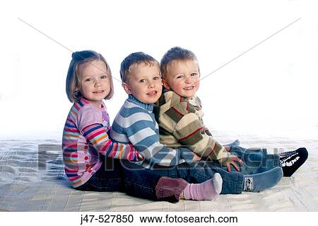 3, three year old children sitting in row on the floor, smiling into camera View Large Photo Image Stock Image - 3, three year old children sitting in row on the floor, smiling into camera. Fotosearch