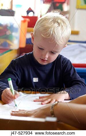 3 year old boy, at nursery, drawing View Large Photo Image Picture - 3 year old boy, at nursery, drawing. Fotosearch