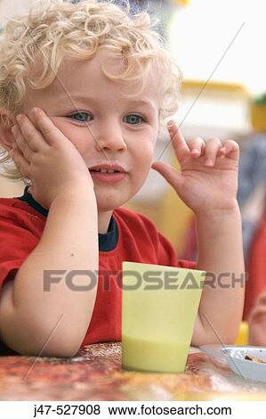 3 year old boy, at nursery, drinking a glass of milk View Large Photo Image Stock Photo - 3 year old boy, at nursery, drinking a glass of milk. Fotosearch