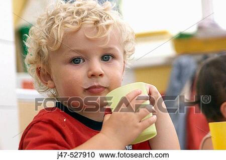 3 year old boy, looking into camera, at nursery, drinking a glass of milk, with milk on his top lip View Large Photo Image Stock Image - 3 year old boy, looking into camera, at nursery, drinking a glass of milk, with milk on his top lip. Fotosearch