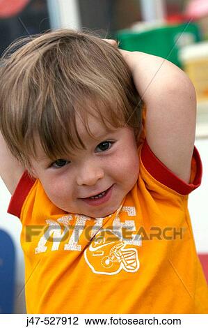 3 year old boy, looking into camera, at nursery, smiling, with his arms above his head View Large Photo Image Stock Image - 3 year old boy, looking into camera, at nursery, smiling, with his arms above his head. Fotosearch