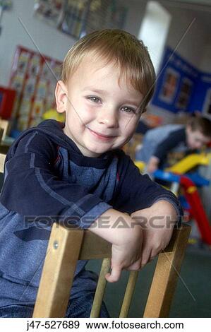 3 year old boy looking into camera at nursery, View Large Photo Image Stock Photo - 3 year old boy looking into camera at nursery,. Fotosearch