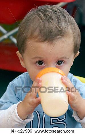 3 year old boy, looking into camera, at nursery, drinking a bottle of milk View Large Photo Image Stock Photograph - 3 year old boy, looking into camera, at nursery, drinking a bottle of milk. Fotosearch