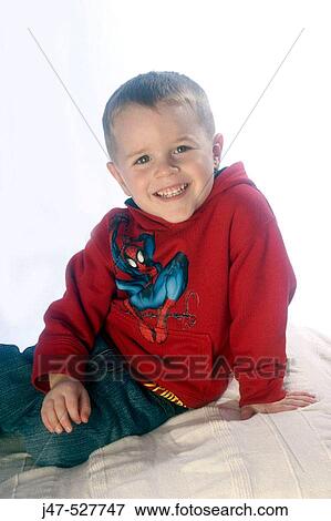 3 year old boy looking into camera, sitting in the studio View Large Photo Image Stock Photo - 3 year old boy looking into camera, sitting in the studio. Fotosearch